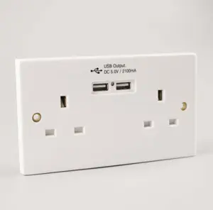 White UK residential wall socket with usb charge of smart charger output