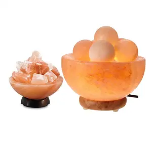Ciotola di fuoco della lampada del sale dell'himalaya a forma di palla di notte del sale del materiale organico del mestiere intagliato a mano dell'himalaya con la palla rotonda