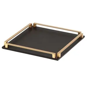 modern black square serving tray with golden finishing handles that are designed to be easy to carry trending kitchenware