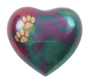 Paw Prints Raku Heart Heart Small Pet Keepsake Cremation Urn features two copper paw prints