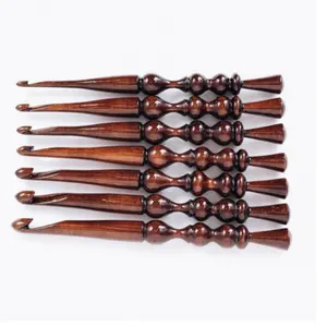 custom made wooden crochet hooks in intricate patterns suitable for knitting supplies stores