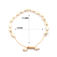 Bracelets tressés extensibles faits à la main en perles d'eau douce blanches brillantes de forme ovale, avec cordon noué.