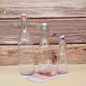 8oz 16oz 32oz empty soft liquid packaging glass bottle with locked swing cap flip top glass drinking bottle bulk sale