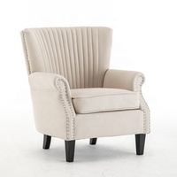 Fauteuil à dossier haut en tissu beige avec garniture cloutée et capitonnage en cannelures, fauteuil d'appoint moelleux pour la décoration moderne de la maison, du bureau et du salon