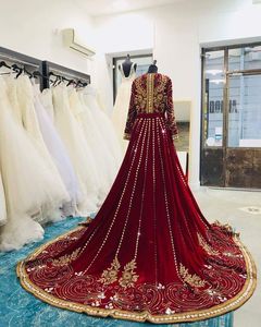 STYLISH & ELEGANT EMBROIDERY OF DABKA, CRYSTAL BEADS,GLASS STONE WORK ON BRIDAL VELVET CAFTAN WITH TRAIL BRIDAL DRESS @ 2022 - Product Image 1