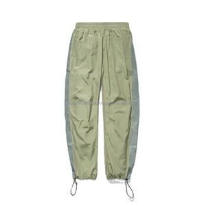 Rue de haute qualité mode hommes vêtements de sport poches latérales bandes réfléchissantes polyester lâche style conique en nylon vent pantalon de survêtement - Product Image 1