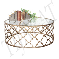Table à manger moderne en métal et verre avec finition polie, structure en acier inoxydable pour salon et décoration intérieure