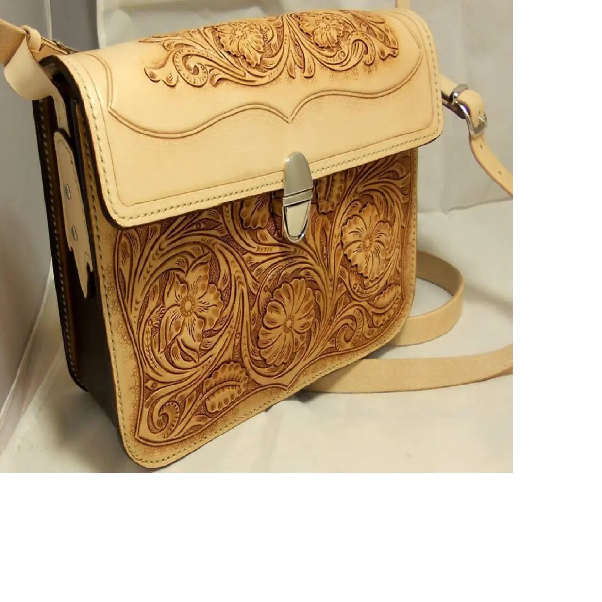 custom made beige clutch hand carved leather wallets, purses and bags made from real leather with intricately carved patterns