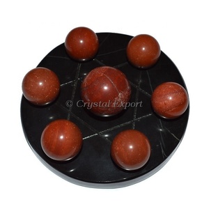 Carved Star of David With 7 Red Jasper Ball on Black Agate Base - Product Image 1