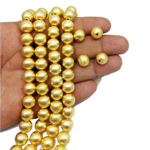 Runde Perlen aus gebürstetem vergoldetem Kupfer
