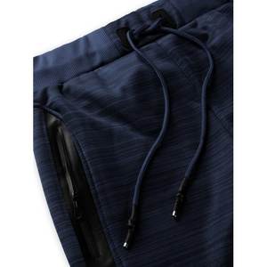 กางเกงนักวิ่งชายทันสมัยมีซิป,กางเกงวอร์มสีพื้นทรงสลิมฟิตลำลองมีกระเป๋า - Product Image 4