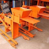 Machine manuelle à briques de terre compressée, petite machine manuelle à briques de ciment emboîtables / Machine manuelle à briques d'ash volatil QMR 2-40