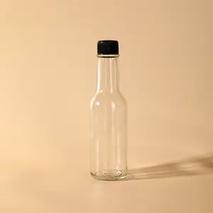 सस्ते स्पष्ट खाली रस की बोतलें 150ml Woozy 5 oz कांच की बोतलें मिनी शराब की बोतल के साथ लाल काले पेंच टोपी शादी एहसान के लिए