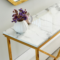 Commode moderne de luxe avec cadre en acier inoxydable doré et plateau en marbre blanc, table console pour salon, couloir ou entrée