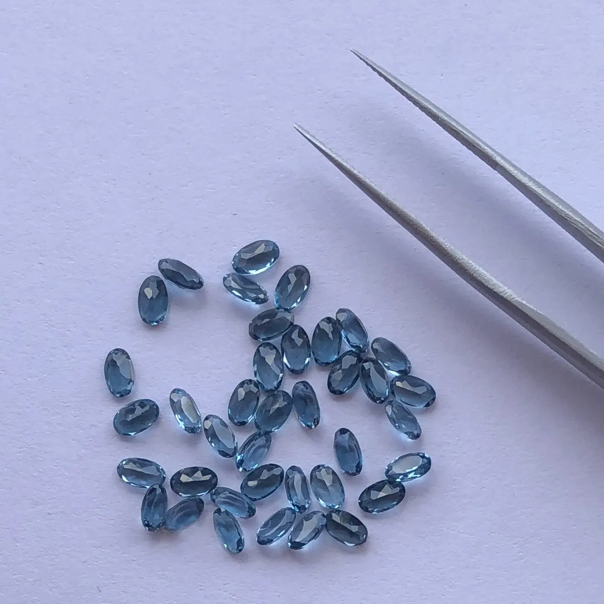 Piedra de Topacio Azul Londres Natural de 5x7mm Corte ovalado Piedras preciosas semipreciosas sueltas Proveedor Compre ahora a precio de distribuidor de fábrica regular