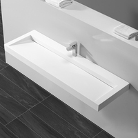 Lavabo mural en surface solide au design moderne pour hôtel, avec drain, finition polie et montage de robinet monotrou