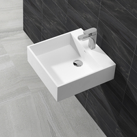 Lavabo mural en surface solide au design moderne pour hôtel, avec drain, finition polie et montage de robinet monotrou